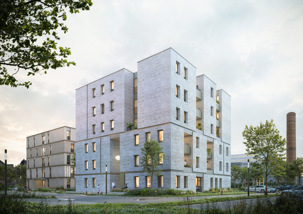 Außenansicht von Haus A des Wohnprojekts Bleichstraße in Bielefeld mit moderner Klinkerfassade und begrüntem Wohnumfeld.